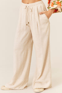 Calça Pantalona De Viscolinho Com Bolsos Bege Yacamim T7